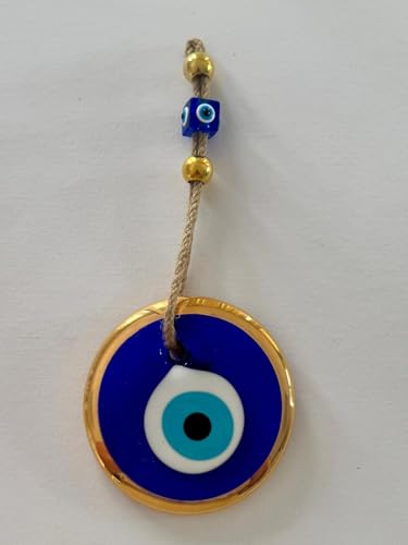 Evil eye pendant with gold rim and blue background on a white background