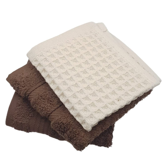 Stack of brown and beige textured towels on a white background
