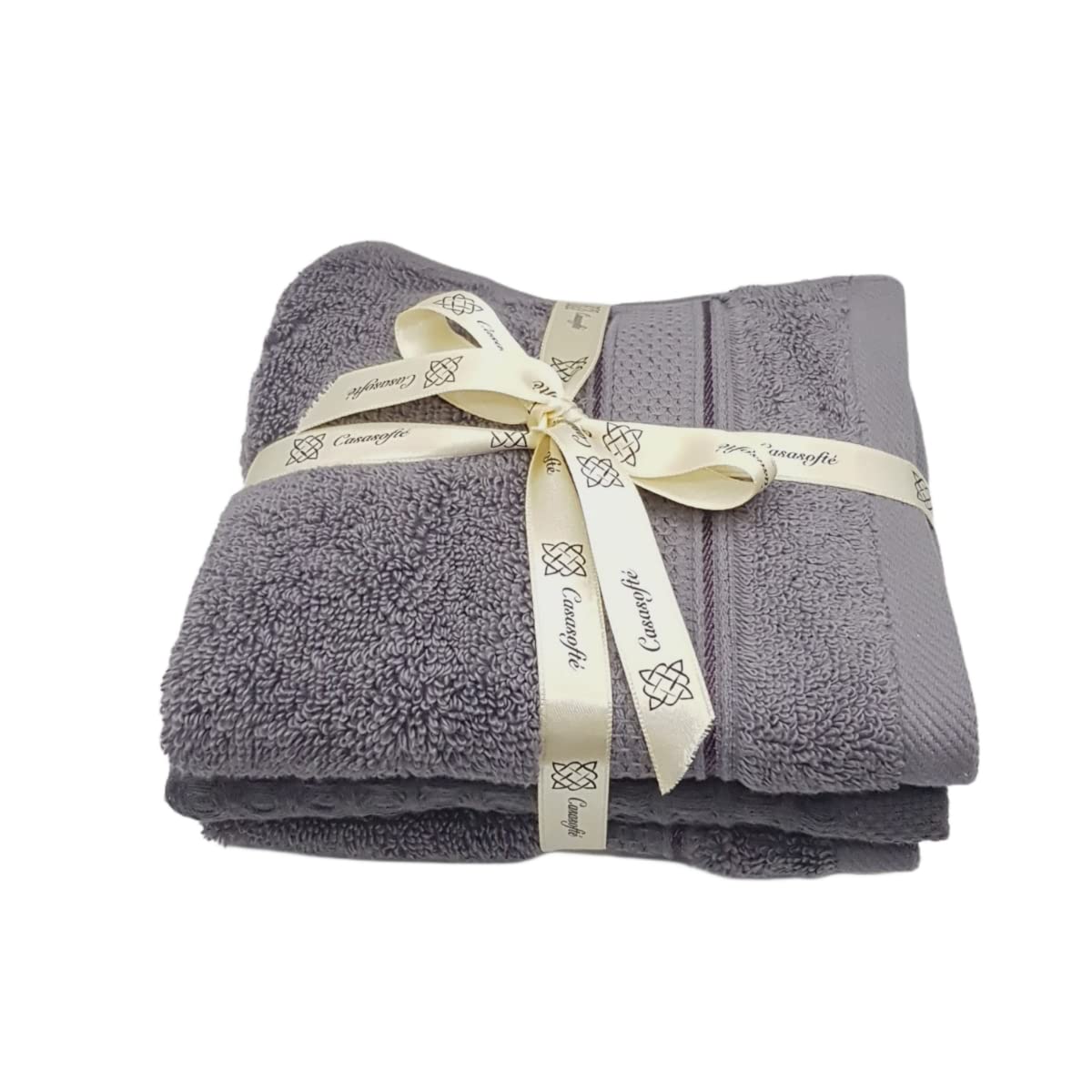 Folded gray towels with a cream ribbon on a white background
