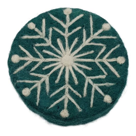 Felted snowflake design on a green background